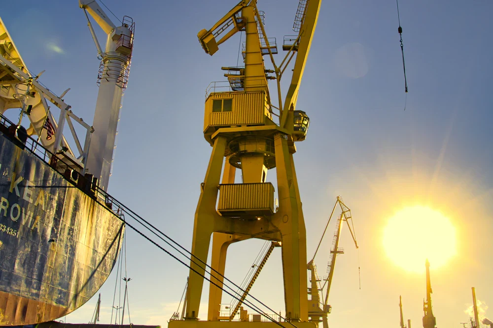 Cranes at the Gdańsk shipyard; illustrative stock photograph by Kaptured by Kasia / Unsplash.