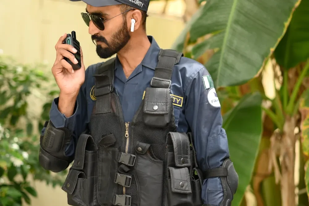 Illustrative stock photograph of security personnel using a radio
