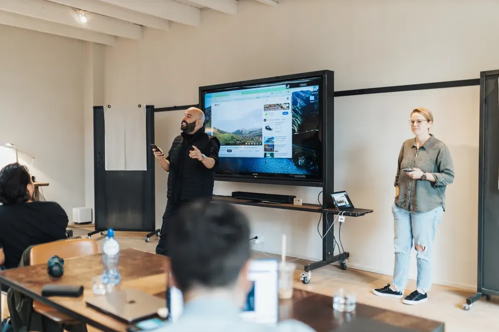 A training meeting with presenters addressing participants